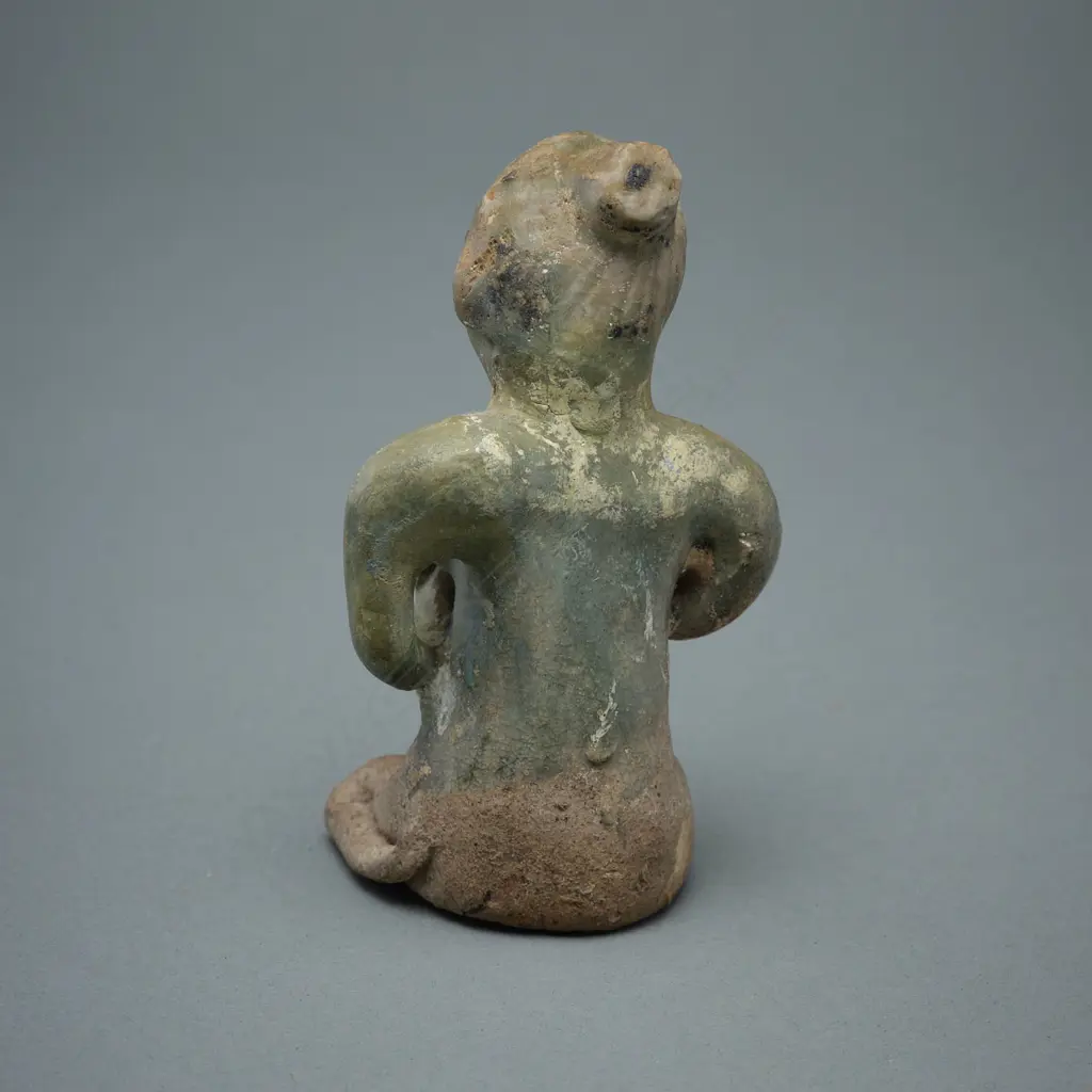 A Sawankhalok stoneware figure (tukatha), Image 1++